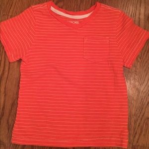 Orange and white striped tee shirt